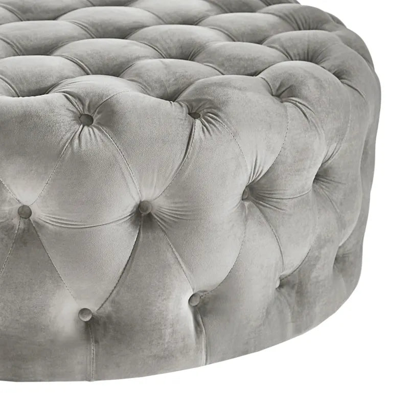 Pouf rond capitonné sur roulettes